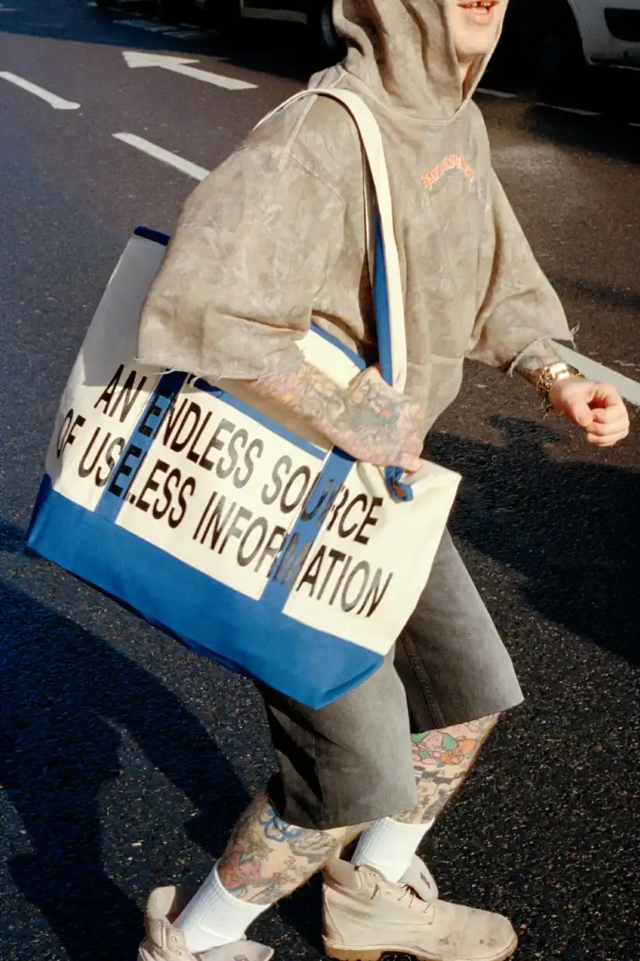 PLEASURES STRANGE WAYS EVERYDAY SPRING 2026 An article detailing the PLEASURES Spring 2026 clothing collection featuring workwear, denim, and graphic shirts shot by Jason Landis in London. (image 13 of 40)