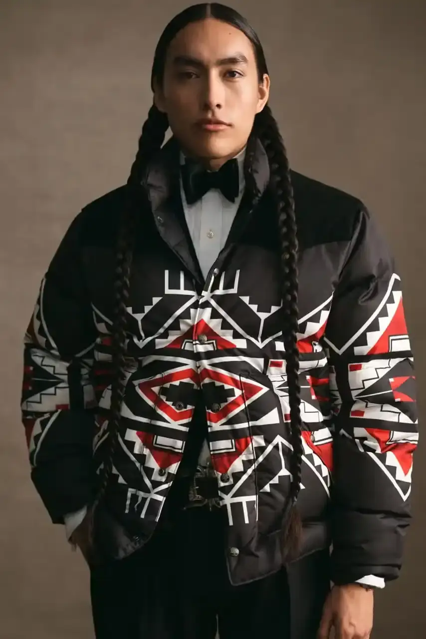 POLO RALPH LAUREN PARTNERS WITH TÓPA Polo Ralph Lauren and TÓPA, an Indigenous-led fashion label, release a collection combining traditional Northern Plains designs with modern apparel. The partnership supports Indigenous language preservation through Thunder Valley CDC. (image 3 of 14)