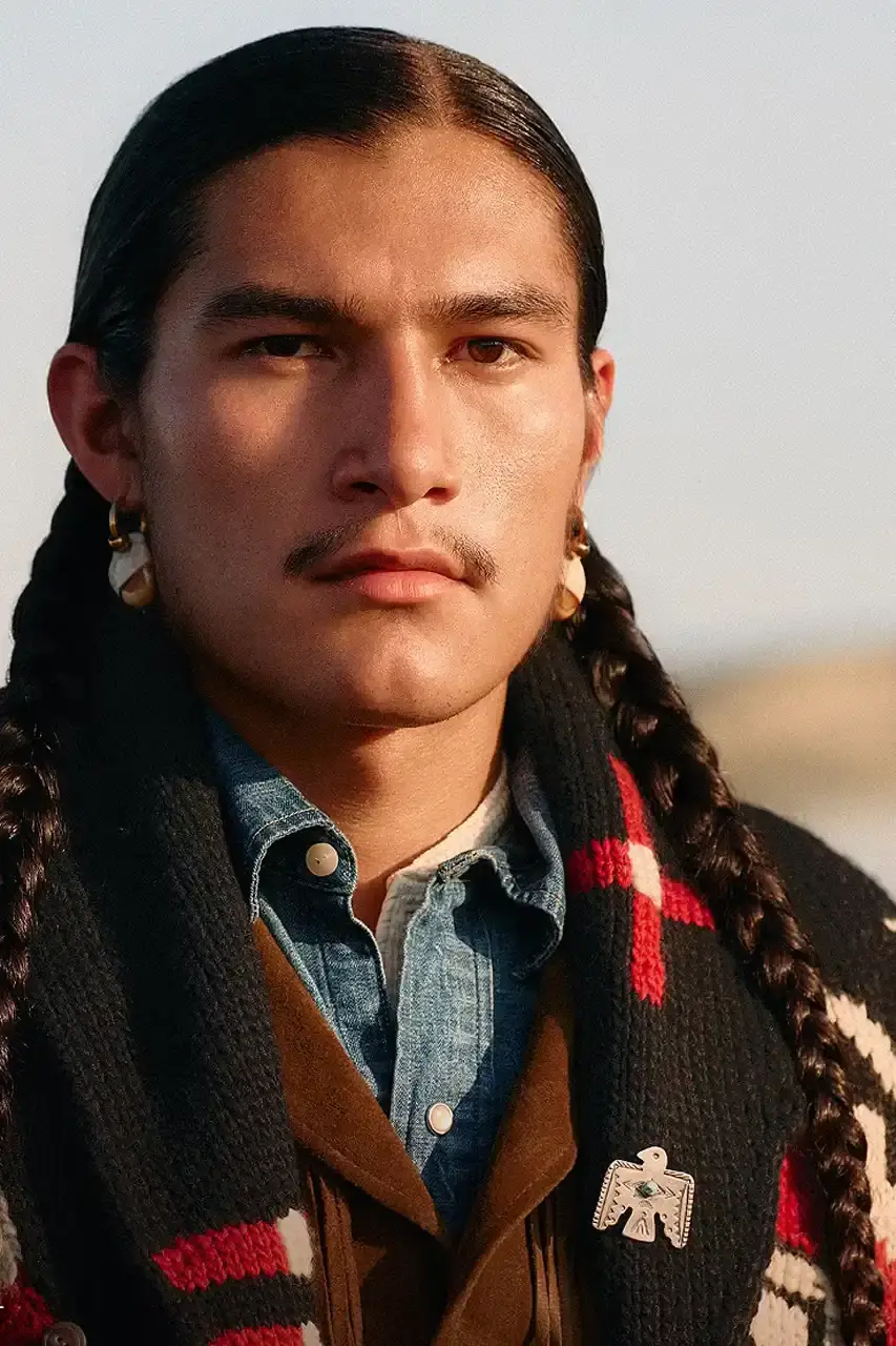 POLO RALPH LAUREN PARTNERS WITH TÓPA Polo Ralph Lauren and TÓPA, an Indigenous-led fashion label, release a collection combining traditional Northern Plains designs with modern apparel. The partnership supports Indigenous language preservation through Thunder Valley CDC. (image 4 of 14)