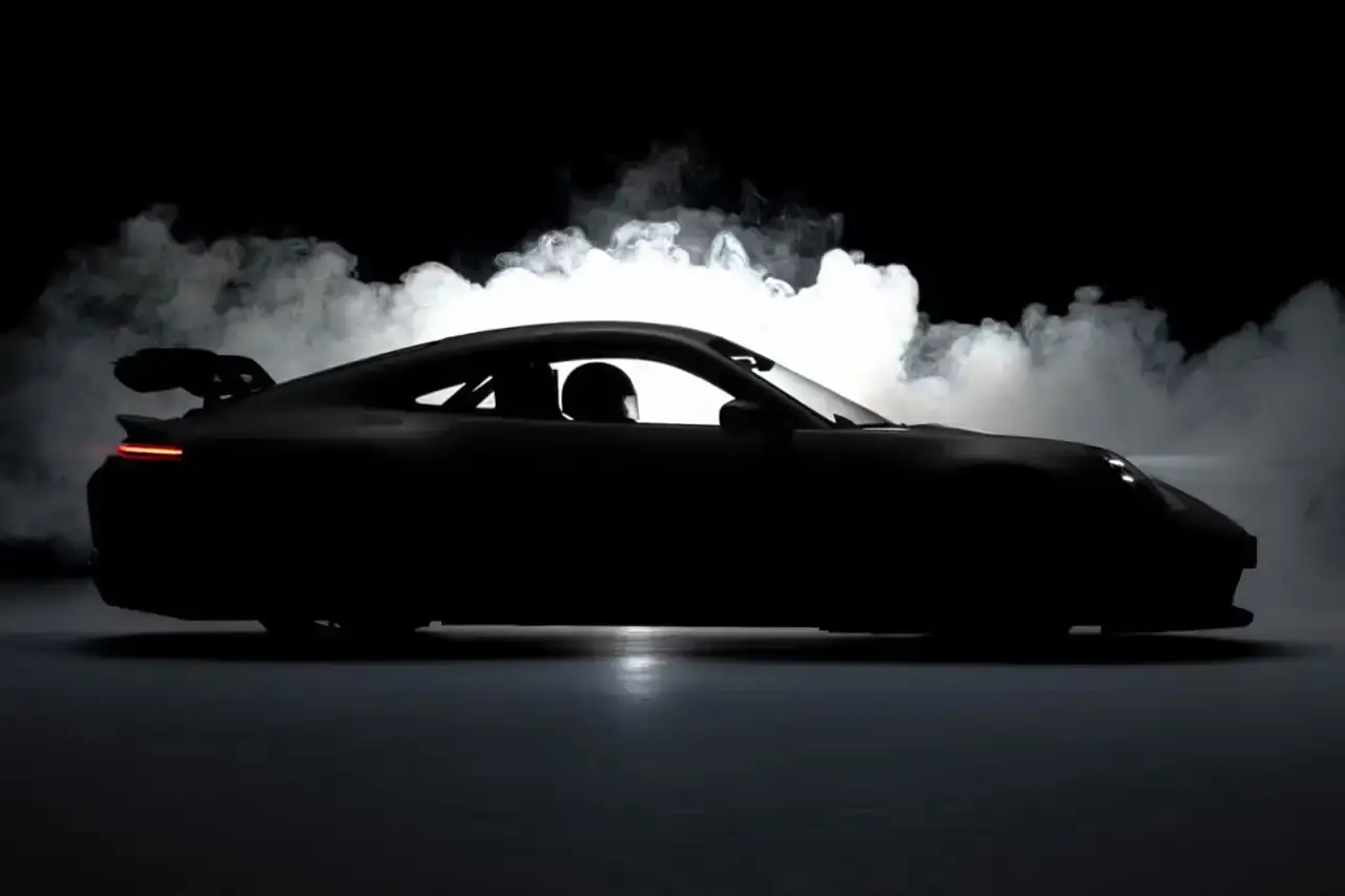 Porsche announces October 18 reveal of new 911 GT model, the first GT variant of the current 911 generation. Digital world premiere to showcase two versions with enhanced customization options and innovative features. Andreas Preuninger, Walter Röhrl, and Jörg Bergmeister to present. Watch live on Porsche's YouTube channel at 18:30 CEST