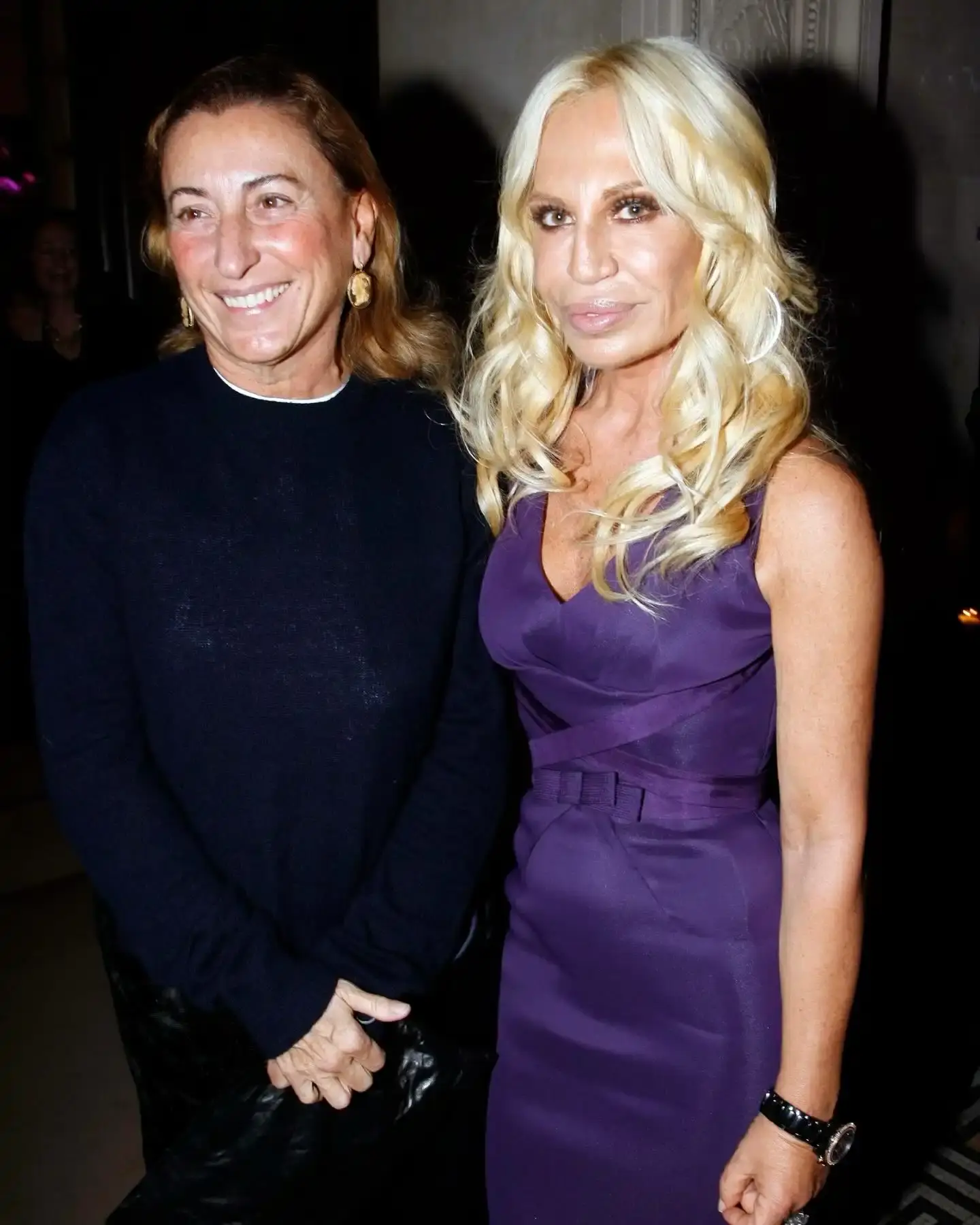 photo of Prada Group's acquisition of Versace for €1.25 billion, with plans to invest an additional €250 million in the brand. It details Versace's recent financial challenges, quotes from key executives including Patrizio Bertelli and Andrea Guerra of Prada Group, and mentions Donatella Versace's positive response to joining the Prada family business. The article provides context about the significance of this merger between two major Italian fashion houses and outlines Prada's strategic vision for Versace's future despite industry uncertainties.