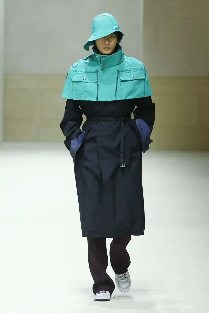 PRADA FALL/WINTER 2026 MENSWEAR REVIEW Analysis of Prada's Fall/Winter 2026 menswear collection presented in Milan, featuring structured tailoring, pastel color palette, and classical architectural influences.