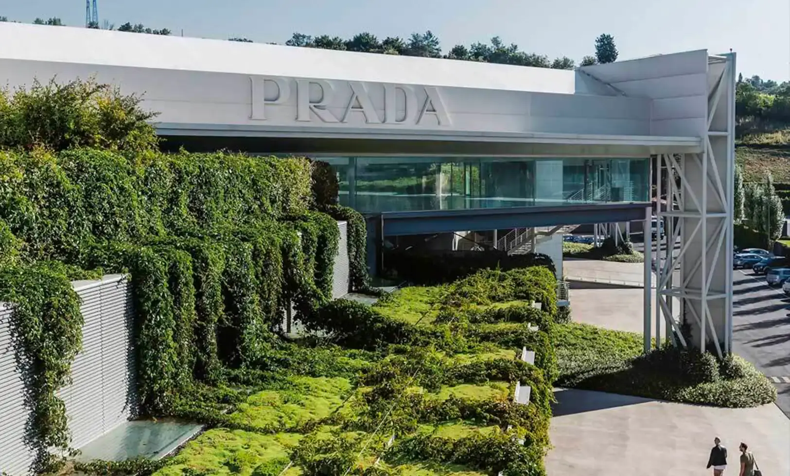 An article describing the Prada Group's extensive fashion archives, detailing the collection's scope, organization, and potential public accessibility. The content highlights the preservation of 52,990 garments, 10,850 eyewear pieces, and unique research prototypes, including costume designs from notable films. The text provides context about the archives' location in Milan and Valvigna, Tuscany, and explores the potential cultural significance of making these archives publicly available.