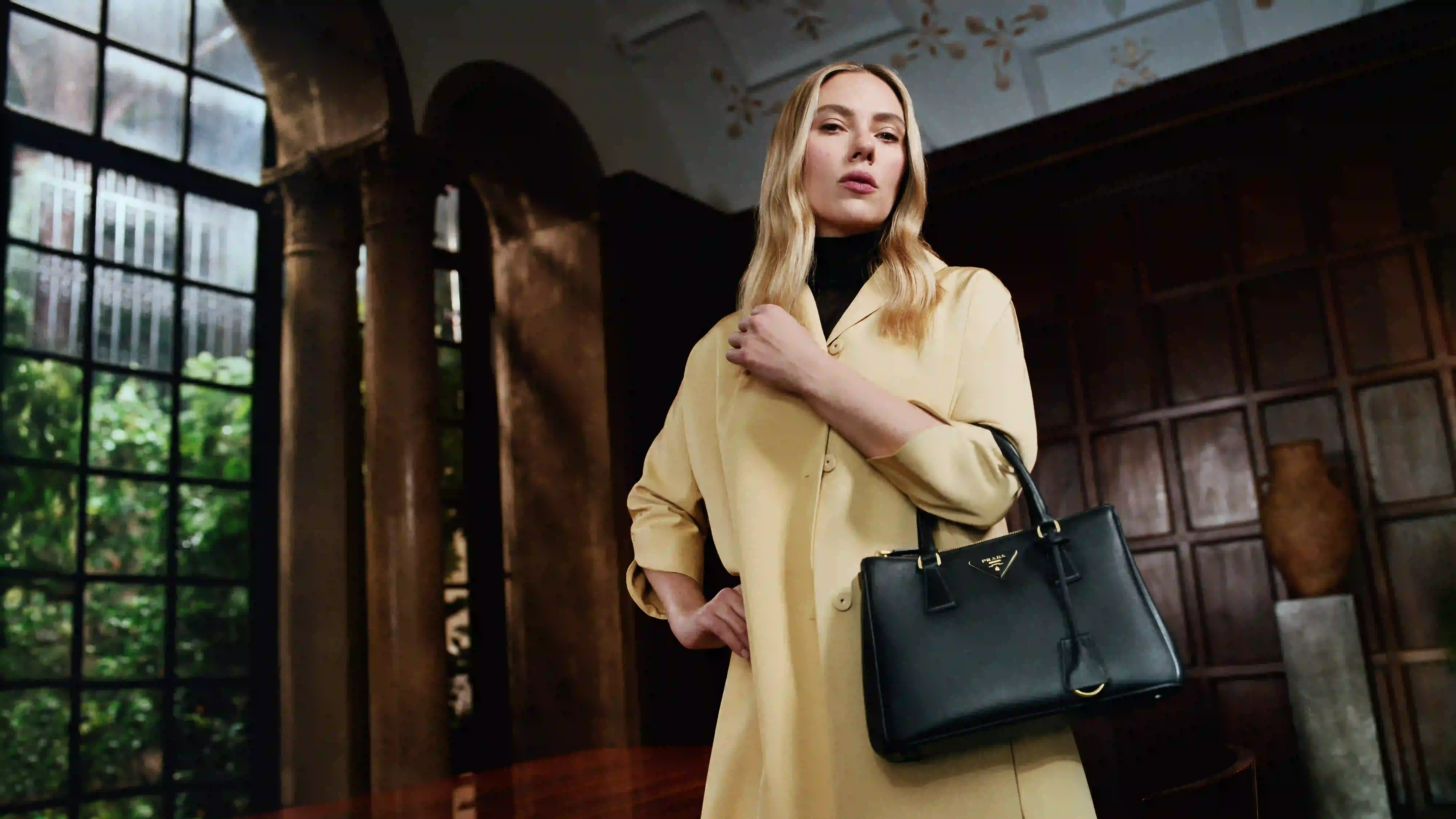PRADA DIRECTED BY YORGOS LANTHIMOS image of Prada’s 2025 Galleria campaign directed by Yorgos Lanthimos, featuring Scarlett Johansson and exploring identity through cinematic imagery. (image 2 of 4)
