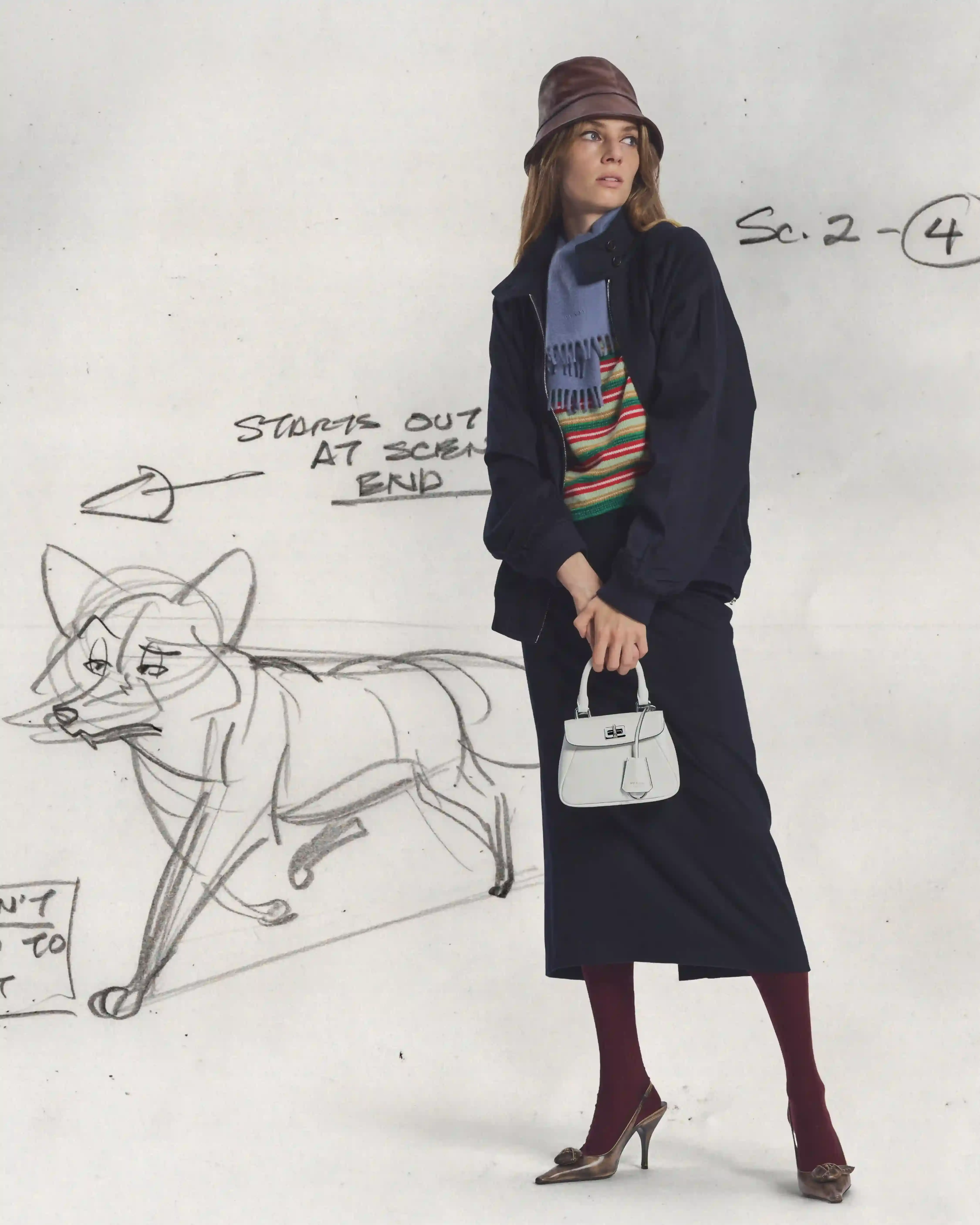 PRADA HOLIDAY 2026 CAMPAIGN BLENDS HAND ANIMATION AND FILM Five actors pose within hand-drawn winter illustrations for the Prada Holiday 2026 campaign photographed by Glen Luchford. (image 9 of 10)