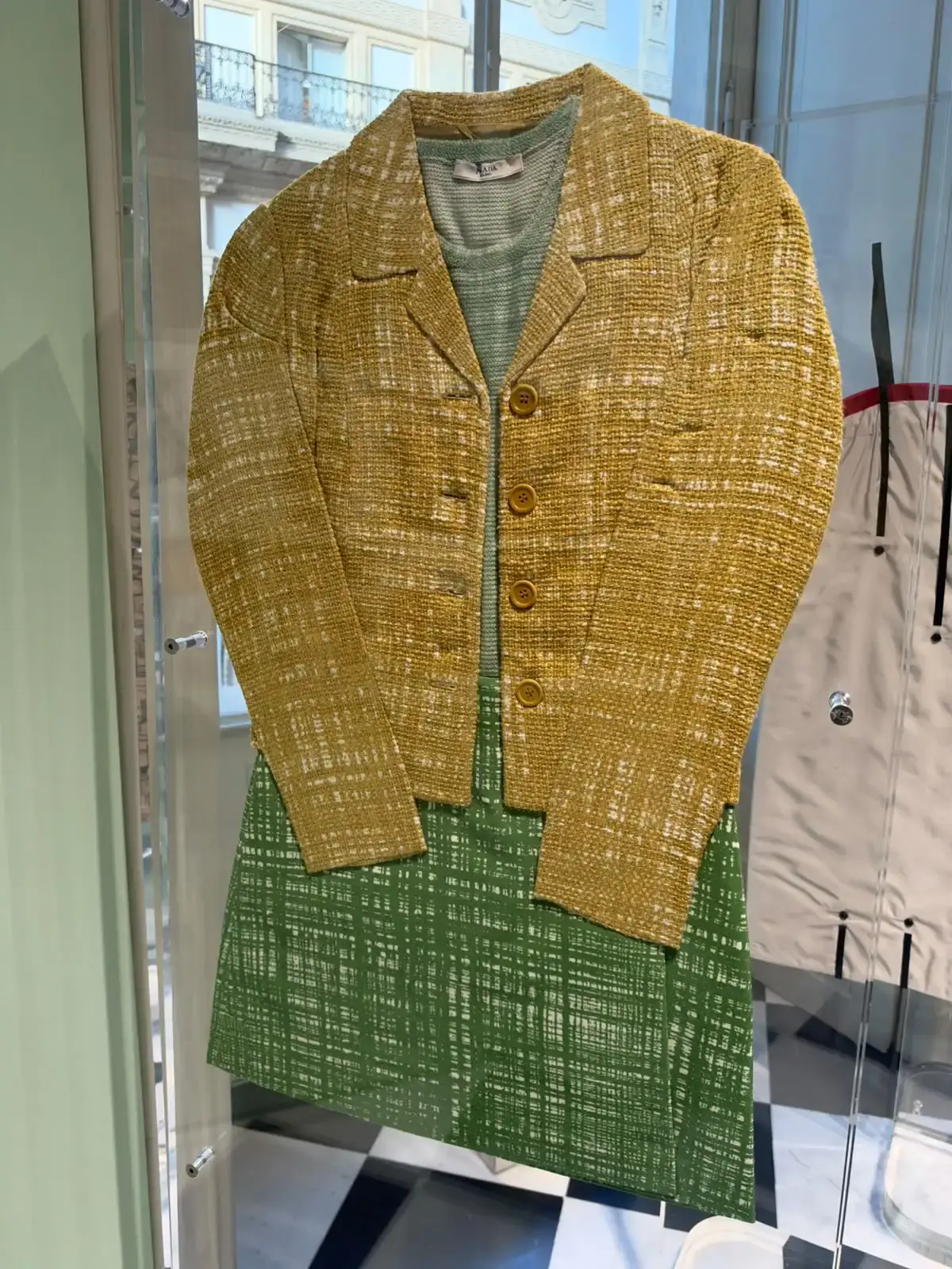 Exhibition view of Pradasphere inside Galleria Vittorio Emanuele II in Milan showing archival Prada designs and garments. (image 4 of 6)