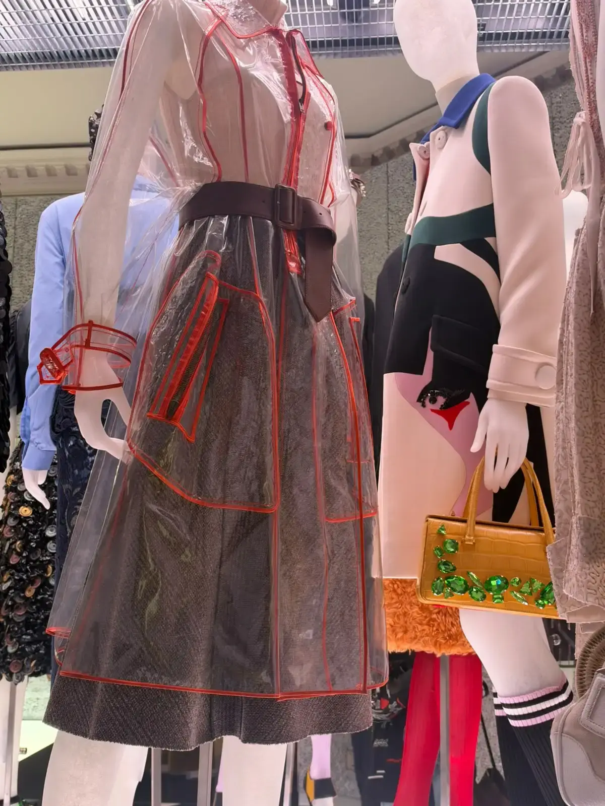 Exhibition view of Pradasphere inside Galleria Vittorio Emanuele II in Milan showing archival Prada designs and garments.