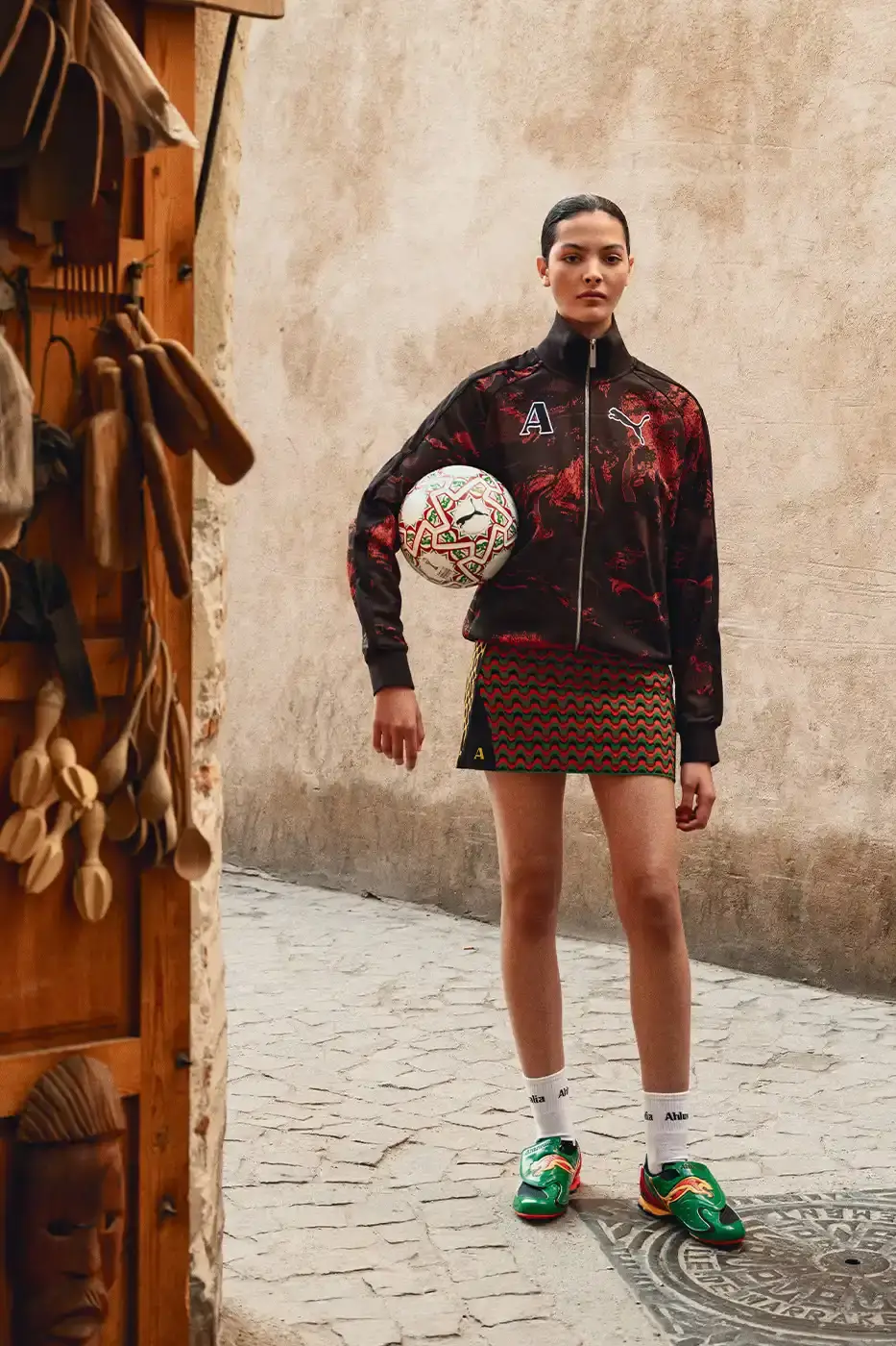 PUMA AND AHLUWALIA RELEASE SECOND FOOTBALL COLLECTION An image detailing a second clothing collaboration between PUMA and designer Priya Ahluwalia focusing on African football aesthetics. (image 9 of 9)