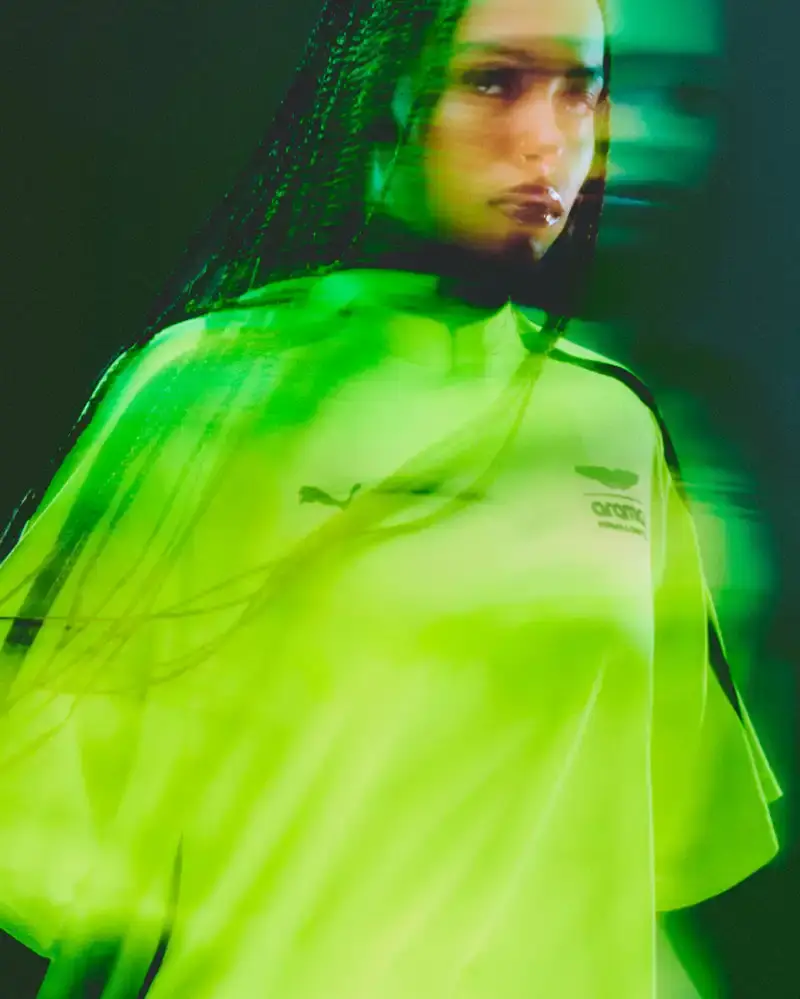 PUMA AND ASTON MARTIN LAUNCH RACING-INSPIRED STREETWEAR Puma releases streetwear collection with Aston Martin Formula 1 team, offering oversized racing-inspired clothing and sneakers in signature green. (image 3 of 6)