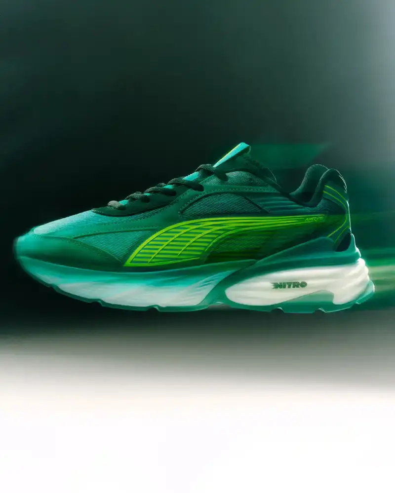 PUMA AND ASTON MARTIN LAUNCH RACING-INSPIRED STREETWEAR Puma releases streetwear collection with Aston Martin Formula 1 team, offering oversized racing-inspired clothing and sneakers in signature green. (image 6 of 6)