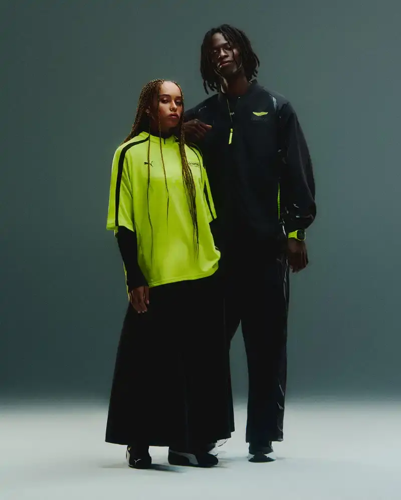 PUMA AND ASTON MARTIN LAUNCH RACING-INSPIRED STREETWEAR Puma releases streetwear collection with Aston Martin Formula 1 team, offering oversized racing-inspired clothing and sneakers in signature green. (image 2 of 6)