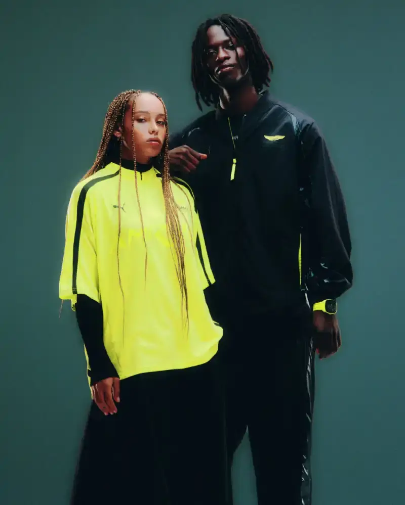 PUMA AND ASTON MARTIN LAUNCH RACING-INSPIRED STREETWEAR Puma releases streetwear collection with Aston Martin Formula 1 team, offering oversized racing-inspired clothing and sneakers in signature green. (image 5 of 6)