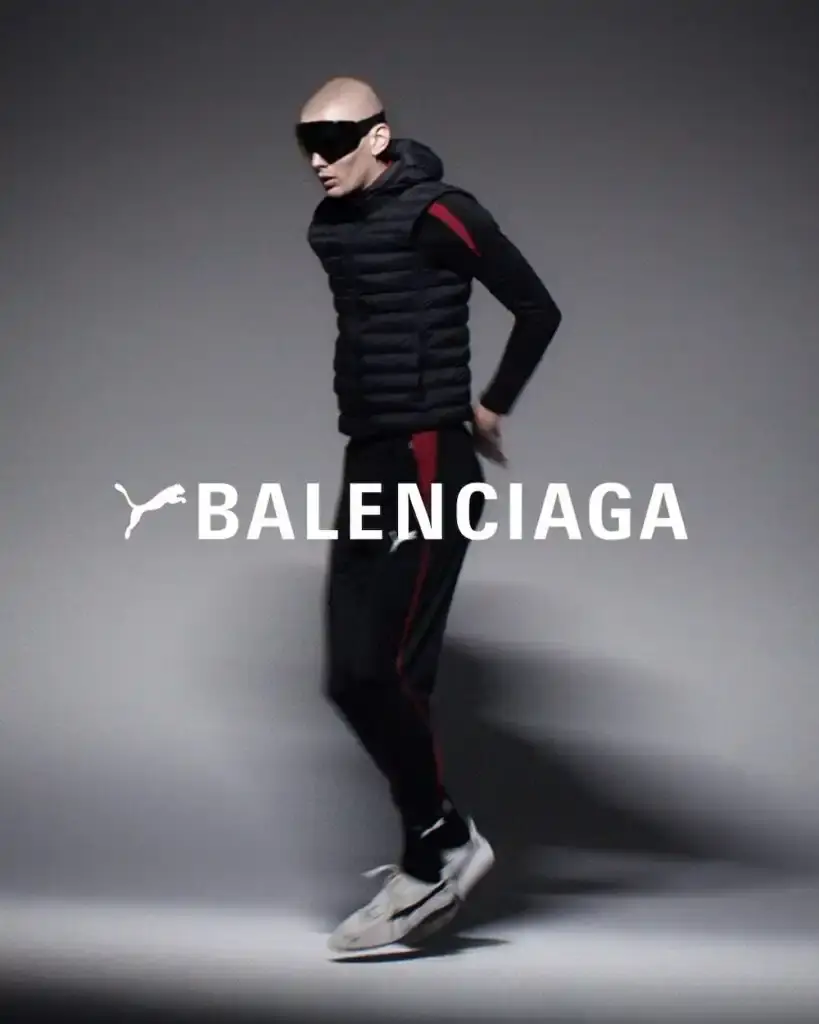 PUMA X BALENCIAGA COLLECTION LAUNCHES image about the retail launch of PUMA and Balenciaga's collaborative Winter 2025 collection, including details about sneaker variations, apparel offerings, and campaign photography. The collection merges athletic and luxury fashion elements across footwear and clothing items. (image 5 of 5)
