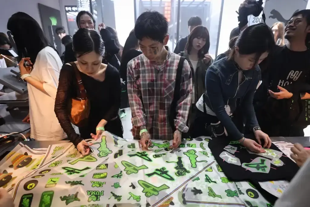 PUMA'S H-STREET SNEAKERS LAUNCH CELEBRATED WITH SEOUL EXHIBITION image of PUMA's H-Street sneakers launch event in Seoul, describing the exhibition venue's athletics-inspired design, notable attendees including K-pop celebrity Rosé, and quotes from PUMA's Global Marketing Director. The piece explains that the exhibition is part of PUMA's Future Archives initiative honoring classic designs and mentions that it remains open to the public through May 18 with various interactive elements including styling areas, music spaces, archival displays, and group activities. (image 7 of 8)