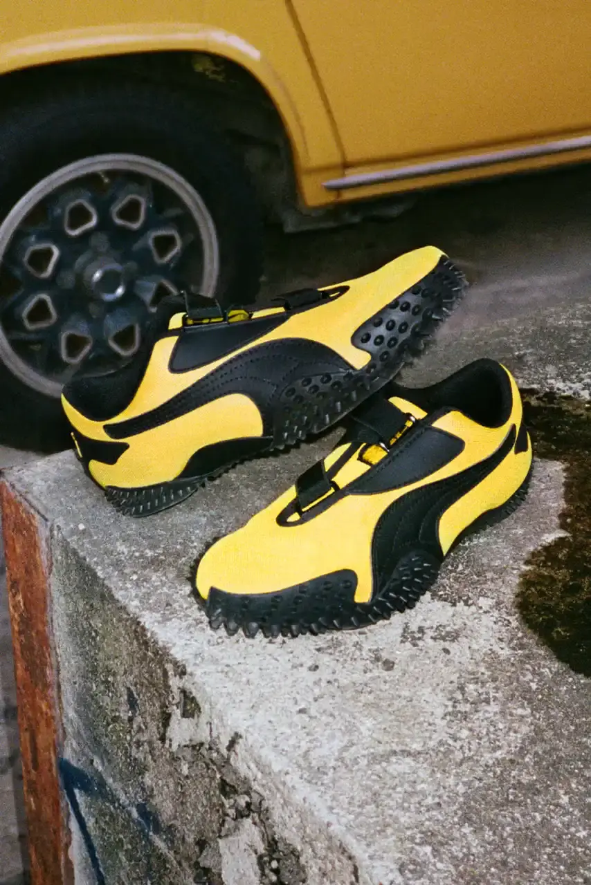 PUMA MOSTRO RETURNS IN PELÉ YELLOW WITH AMELIA GRAY image of PUMA's latest Mostro sneaker release in yellow colorway, featuring model Amelia Gray in promotional campaign imagery. Includes product specifications, pricing at $120 USD, and June 5 release date through PUMA retail channels. (image 7 of 7)