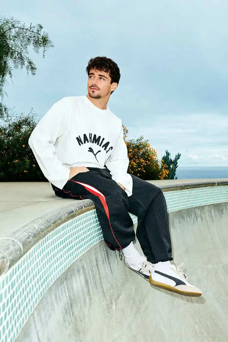 PUMA AND NAHMIAS RELEASE WEST COAST INSPIRED SPEEDCAT SNEAKERS An image detailing the new apparel and footwear collection from PUMA and NAHMIAS featuring Formula 1 driver Charles Leclerc. (image 6 of 10)