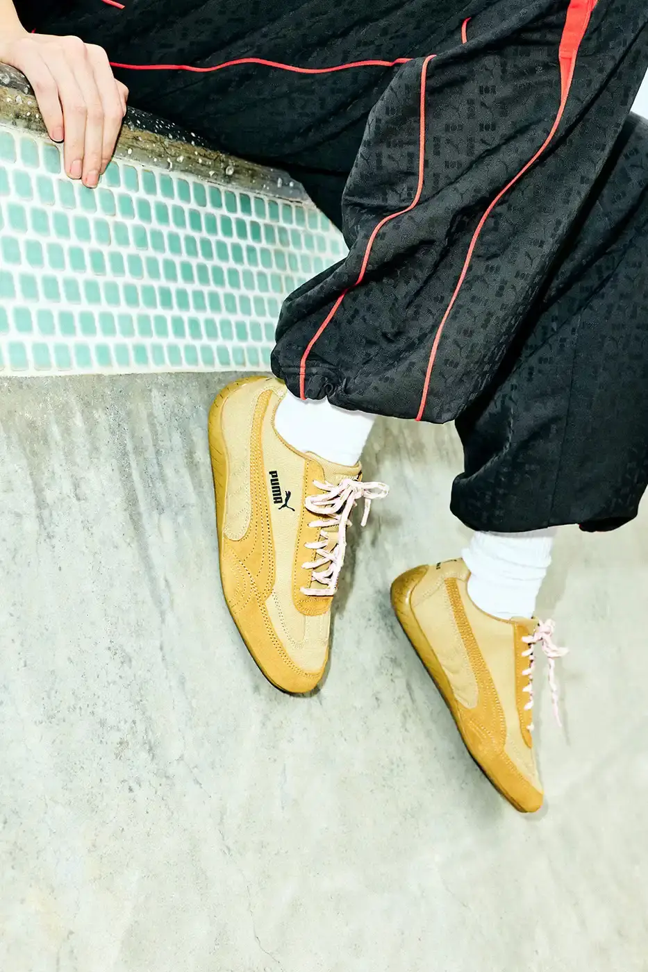 PUMA AND NAHMIAS RELEASE WEST COAST INSPIRED SPEEDCAT SNEAKERS An image detailing the new apparel and footwear collection from PUMA and NAHMIAS featuring Formula 1 driver Charles Leclerc. (image 8 of 10)