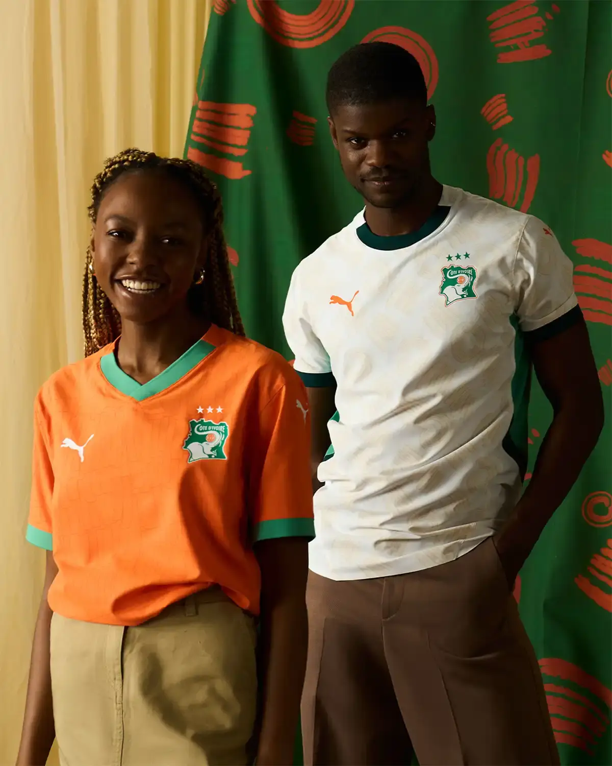 Puma Ghana's yellow away jersey representing the Gold Coast heritage, with traditional adinkra symbols on sleeves and black accents