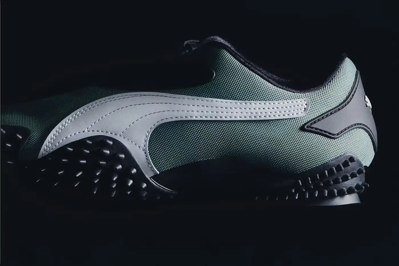 Puma PUMA Mostro OG sneakers displayed in three colorways - Team Royal blue with silver accents, Green Moon green with silver detailing, and All Time Red with silver trim. Each shoe features the model's distinctive spiked sole, mesh upper, and hook-and-loop fastening system. (image 6 of 8)