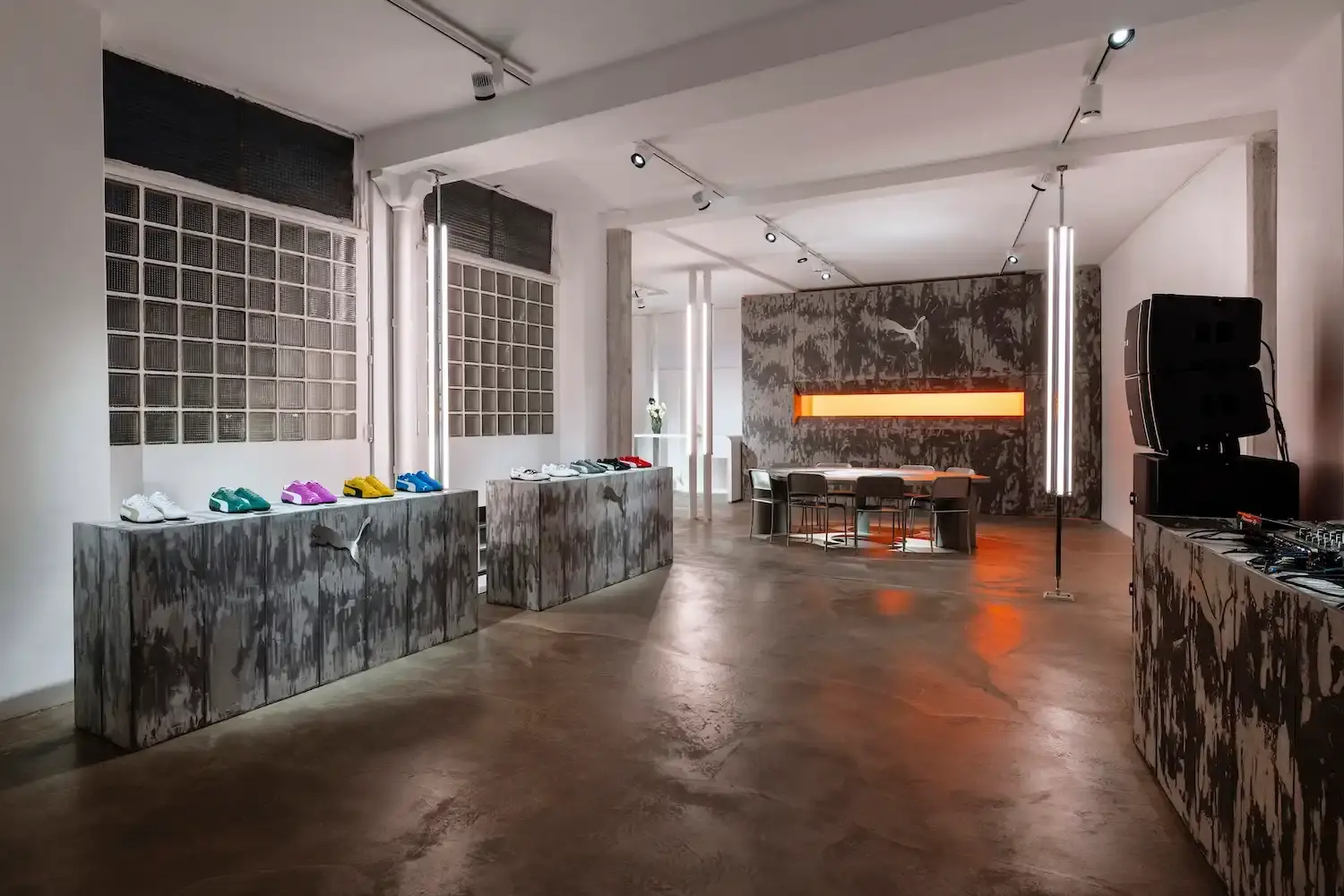 Puma Image shows PUMA's Paris Fashion Week event promotional visual, highlighting collaborative design, urban culture, and the Mostro sneaker with diverse creative elements in the background. (image 4 of 6)