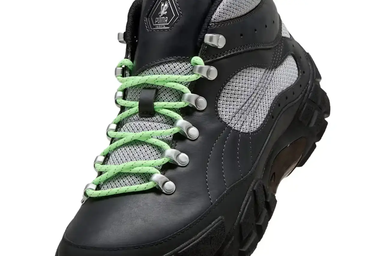 Puma PUMA x Skepta Skope Forever Mid sneaker in Flat Dark Gray/PUMA Silver/PUMA Black colorway, featuring black leather uppers, gray mesh panels, chrome accents, and bright turquoise laces. The shoe has a distinctive Y2K-inspired silhouette with utilitarian details. (image 9 of 10)