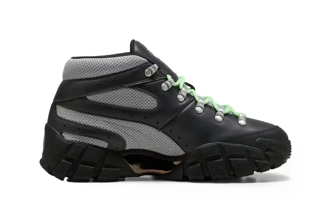 Puma PUMA x Skepta Skope Forever Mid sneaker in Flat Dark Gray/PUMA Silver/PUMA Black colorway, featuring black leather uppers, gray mesh panels, chrome accents, and bright turquoise laces. The shoe has a distinctive Y2K-inspired silhouette with utilitarian details. (image 5 of 10)