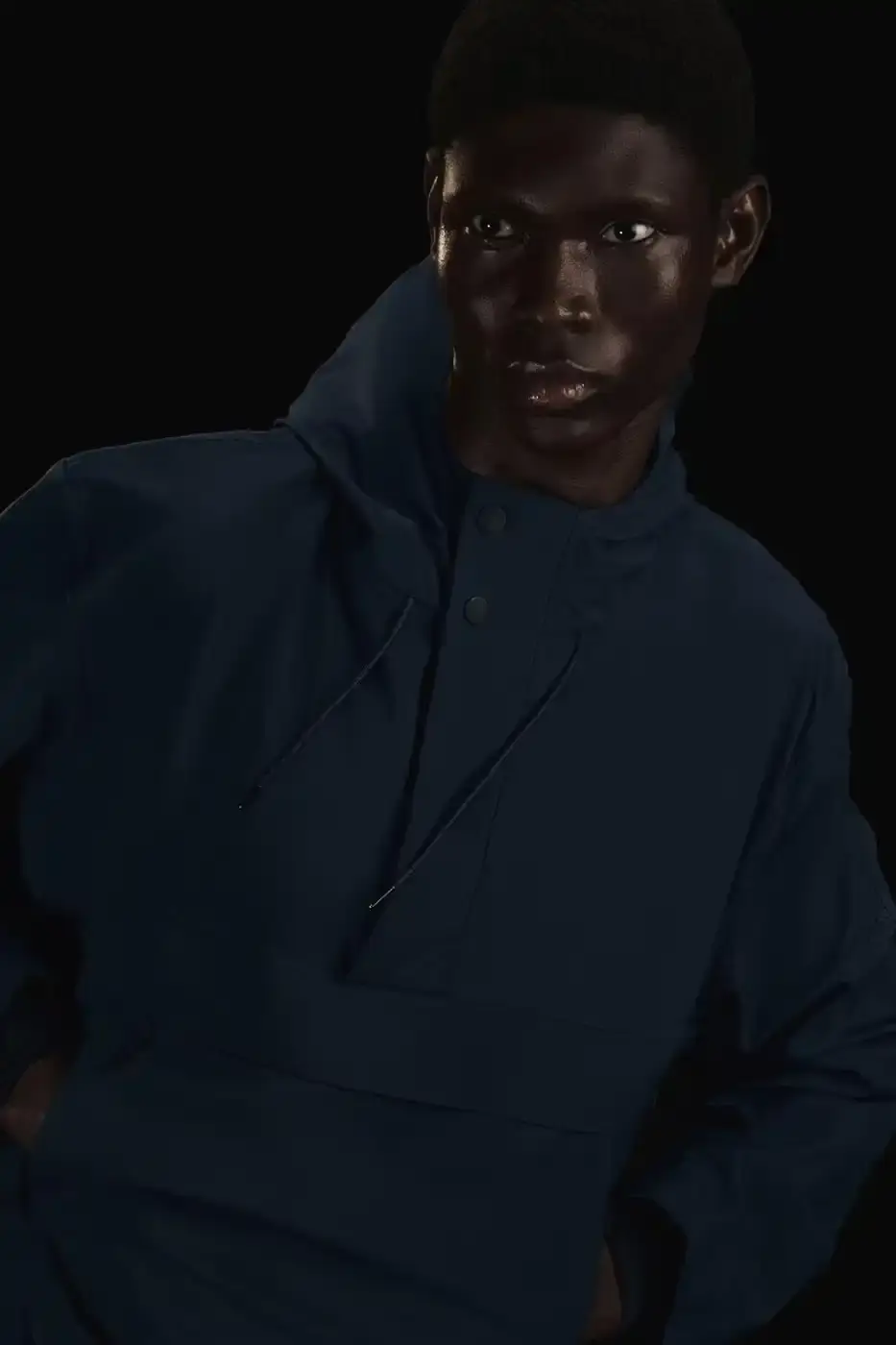 Rains RAINS Spring/Summer 2025 collection featuring models wearing the new Suva Hardshell jackets and pants in an urban setting, showcasing the matte finish and minimalist design of the waterproof apparel. (image 6 of 10)