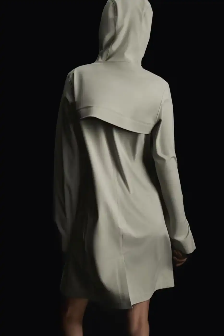 Rains RAINS Spring/Summer 2025 collection featuring models wearing the new Suva Hardshell jackets and pants in an urban setting, showcasing the matte finish and minimalist design of the waterproof apparel. (image 7 of 10)