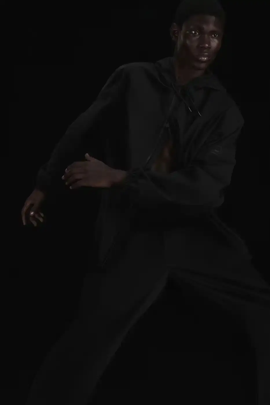 Rains RAINS Spring/Summer 2025 collection featuring models wearing the new Suva Hardshell jackets and pants in an urban setting, showcasing the matte finish and minimalist design of the waterproof apparel. (image 9 of 10)