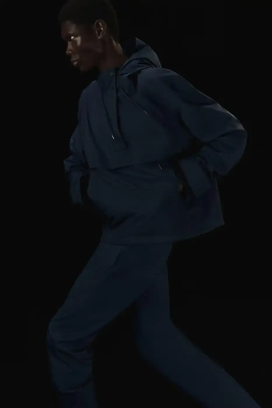 Rains RAINS Spring/Summer 2025 collection featuring models wearing the new Suva Hardshell jackets and pants in an urban setting, showcasing the matte finish and minimalist design of the waterproof apparel. (image 5 of 10)