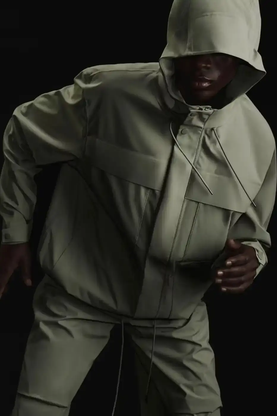 RAINS INTRODUCES SUVA FABRIC FOR SPRING/SUMMER 2025 RAINS Spring/Summer 2025 collection featuring models wearing the new Suva Hardshell jackets and pants in an urban setting, showcasing the matte finish and minimalist design of the waterproof apparel.