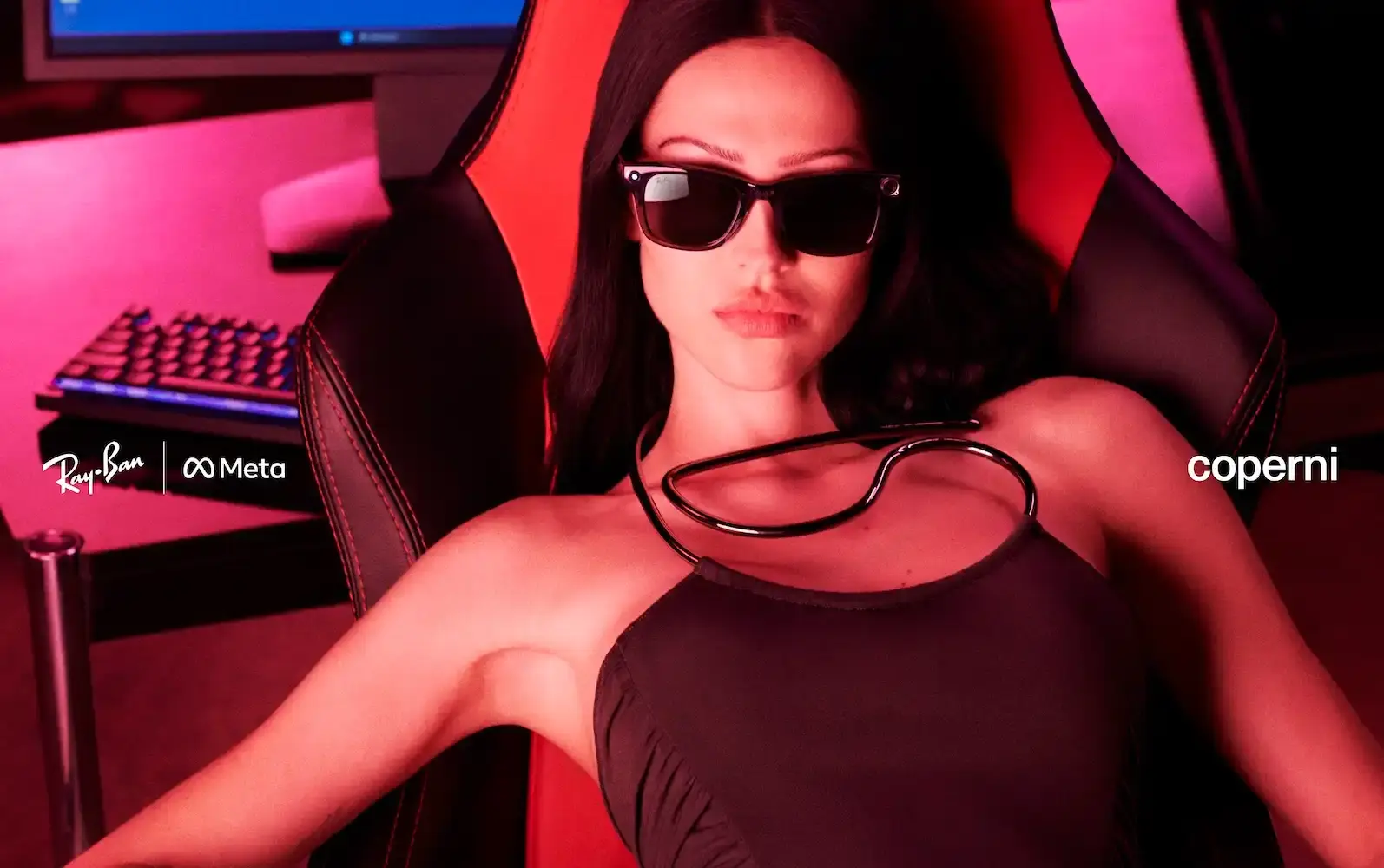 Limited edition Ray-Ban Meta x Coperni smart glasses featuring transparent black frames with gray mirrored lenses. The Wayfarer-style sunglasses include built-in AI capabilities, camera, and audio features, presented in a special charging case with Limited Edition numbering visible on the inner temple.