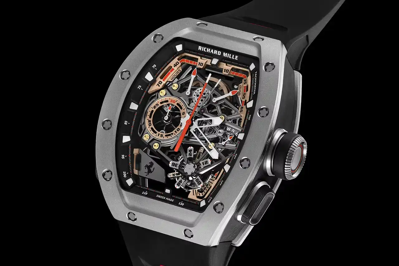 PRECISION MECHANICS: RICHARD MILLE'S FERRARI TRIBUTE WATCH A collaborative watch between Richard Mille and Ferrari, highlighting its design, technological features, and automotive-inspired elements. The text provides a comprehensive overview of the RM 43-01 Tourbillon Split-Seconds Chronograph, detailing its mechanical specifications, design influences from Ferrari's Centro Stile, and limited edition variants. The description covers technical aspects such as power reserve, movement design, and aesthetic connections to Ferrari's automotive heritage, making the complex watch design accessible to readers with varying levels of horological expertise. (image 7 of 7)