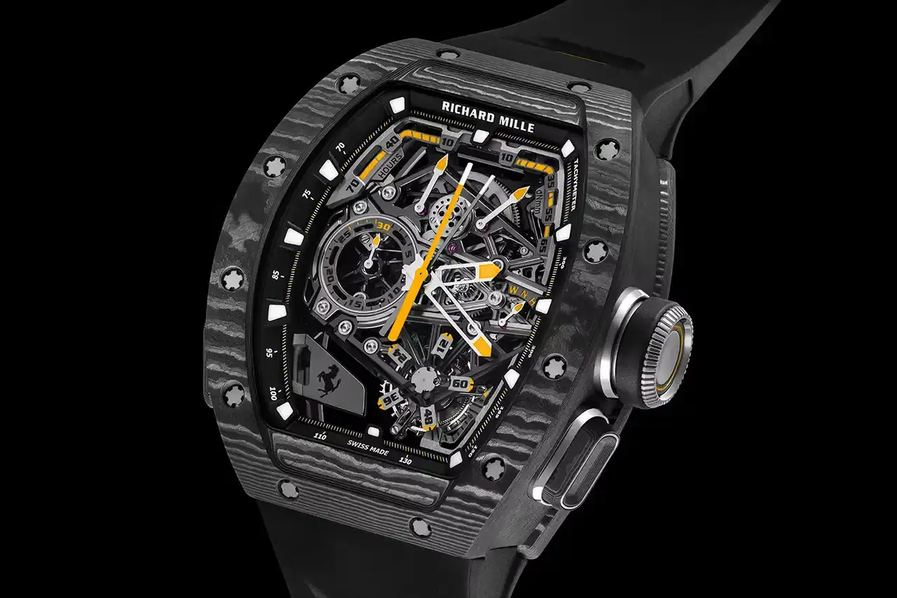 PRECISION MECHANICS: RICHARD MILLE'S FERRARI TRIBUTE WATCH A collaborative watch between Richard Mille and Ferrari, highlighting its design, technological features, and automotive-inspired elements. The text provides a comprehensive overview of the RM 43-01 Tourbillon Split-Seconds Chronograph, detailing its mechanical specifications, design influences from Ferrari's Centro Stile, and limited edition variants. The description covers technical aspects such as power reserve, movement design, and aesthetic connections to Ferrari's automotive heritage, making the complex watch design accessible to readers with varying levels of horological expertise. (image 5 of 7)