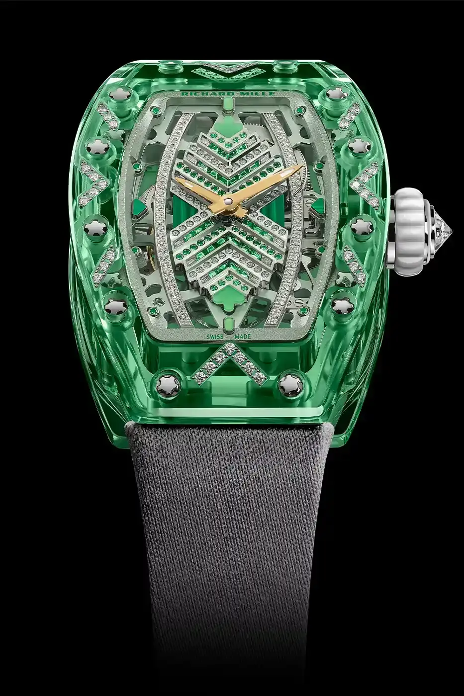 Richard Mille Richard Mille RM 07-02 luxury watch with a transparent colored sapphire crystal case. The watch features a geometric pattern dial set with precious stones including diamonds, sapphires, and ornamental stones. The skeletonized automatic movement is visible through the translucent case, showing intricate mechanical details and gold components. (image 7 of 22)
