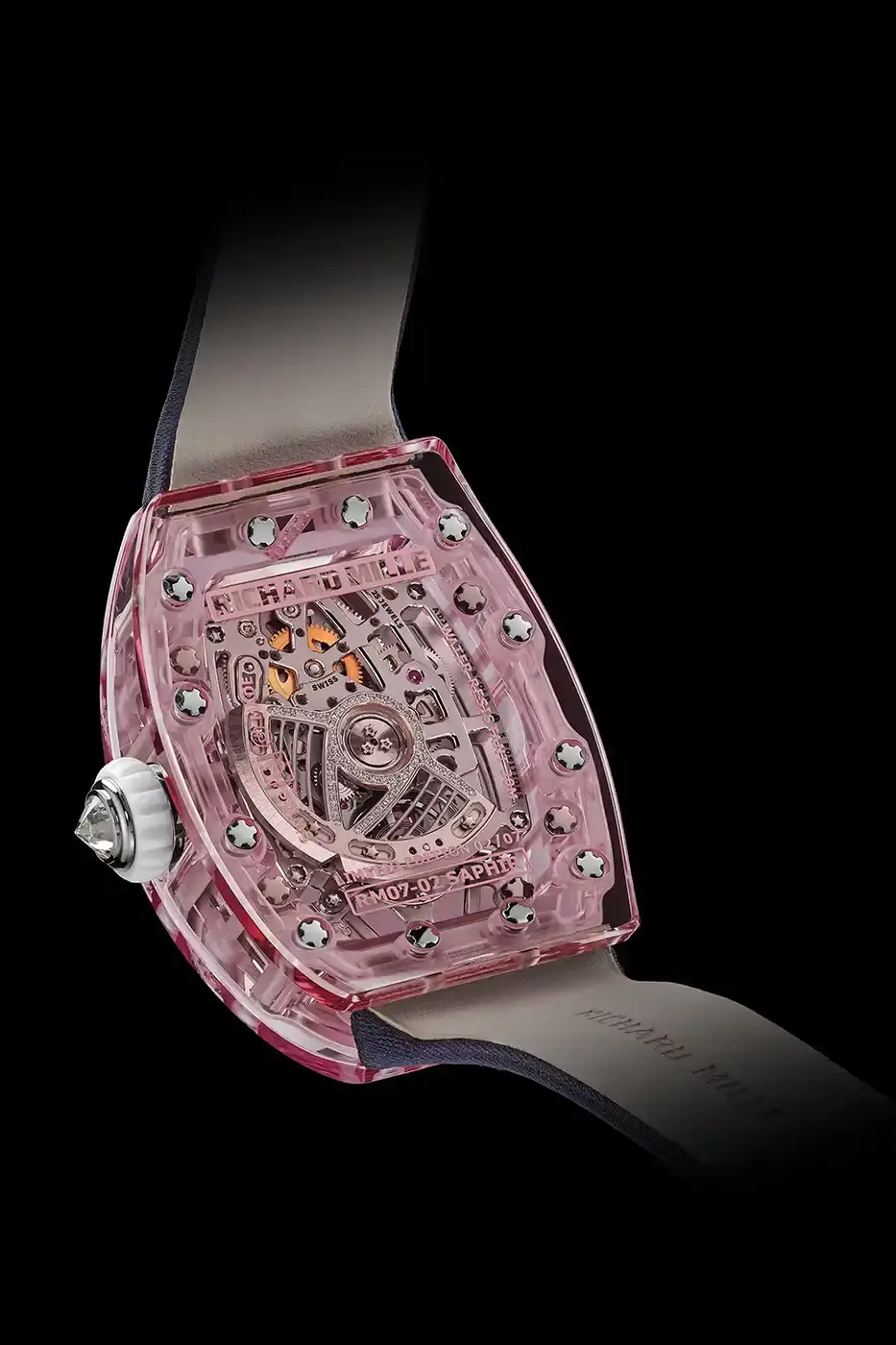Richard Mille Richard Mille RM 07-02 luxury watch with a transparent colored sapphire crystal case. The watch features a geometric pattern dial set with precious stones including diamonds, sapphires, and ornamental stones. The skeletonized automatic movement is visible through the translucent case, showing intricate mechanical details and gold components. (image 13 of 22)