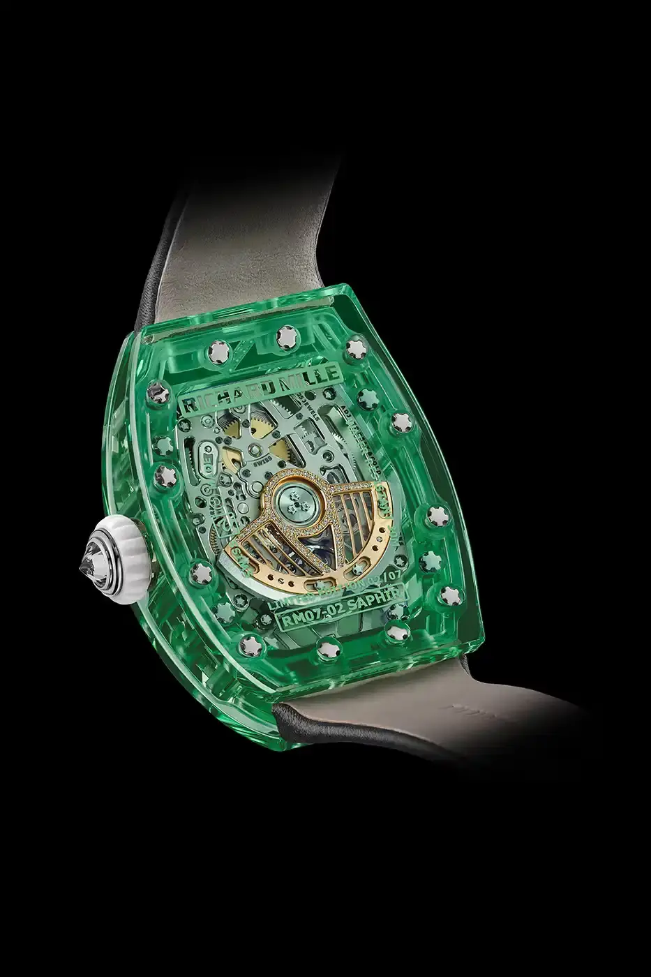 Richard Mille Richard Mille RM 07-02 luxury watch with a transparent colored sapphire crystal case. The watch features a geometric pattern dial set with precious stones including diamonds, sapphires, and ornamental stones. The skeletonized automatic movement is visible through the translucent case, showing intricate mechanical details and gold components. (image 12 of 22)