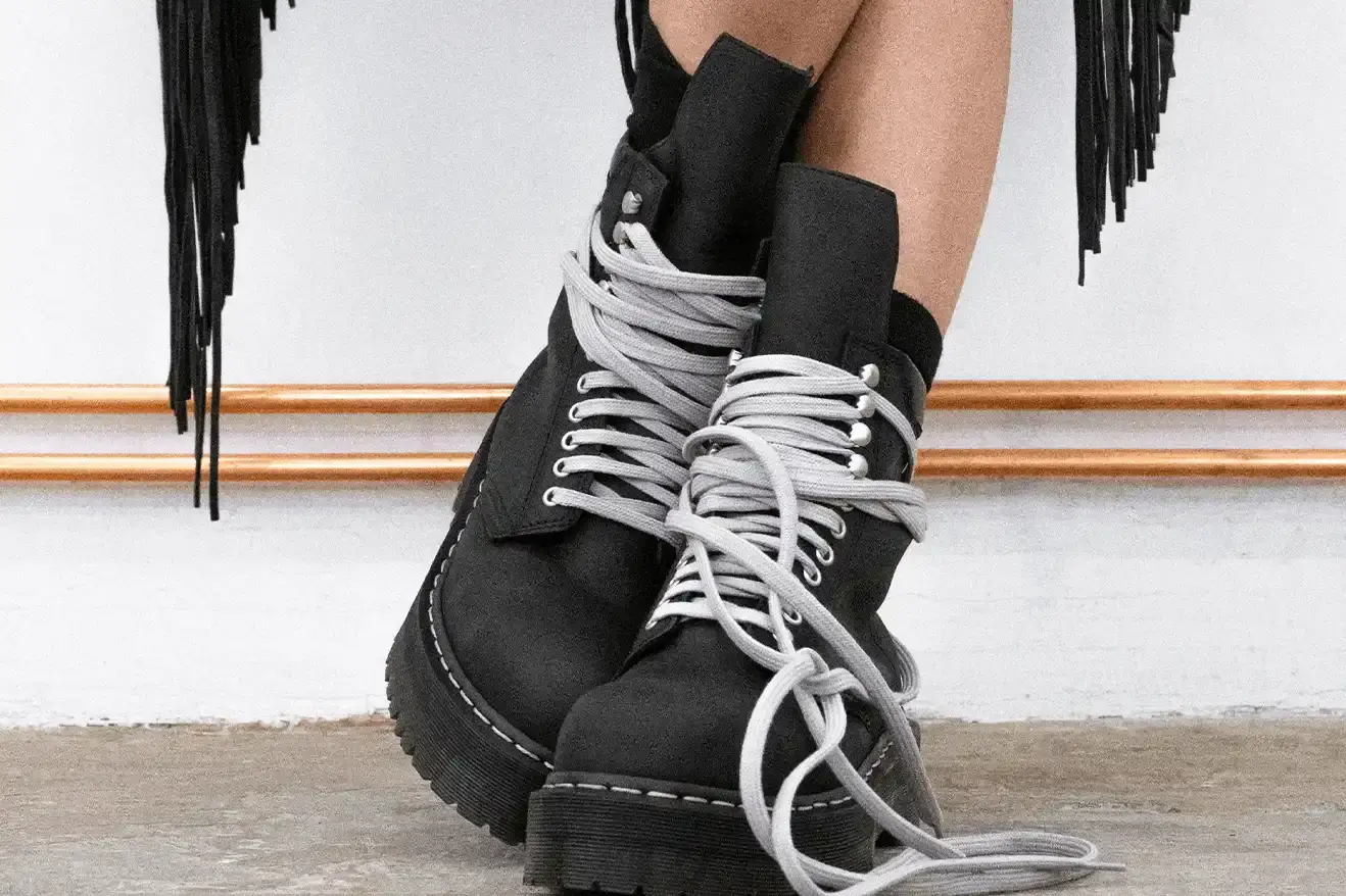 RICK OWENS AND DR. MARTENS RETURN WITH QUAD BOOT COLLECTION Fashion collaboration between Rick Owens and Dr. Martens produces three black leather boots with platform soles, releasing October 16, 2025. (image 8 of 10)