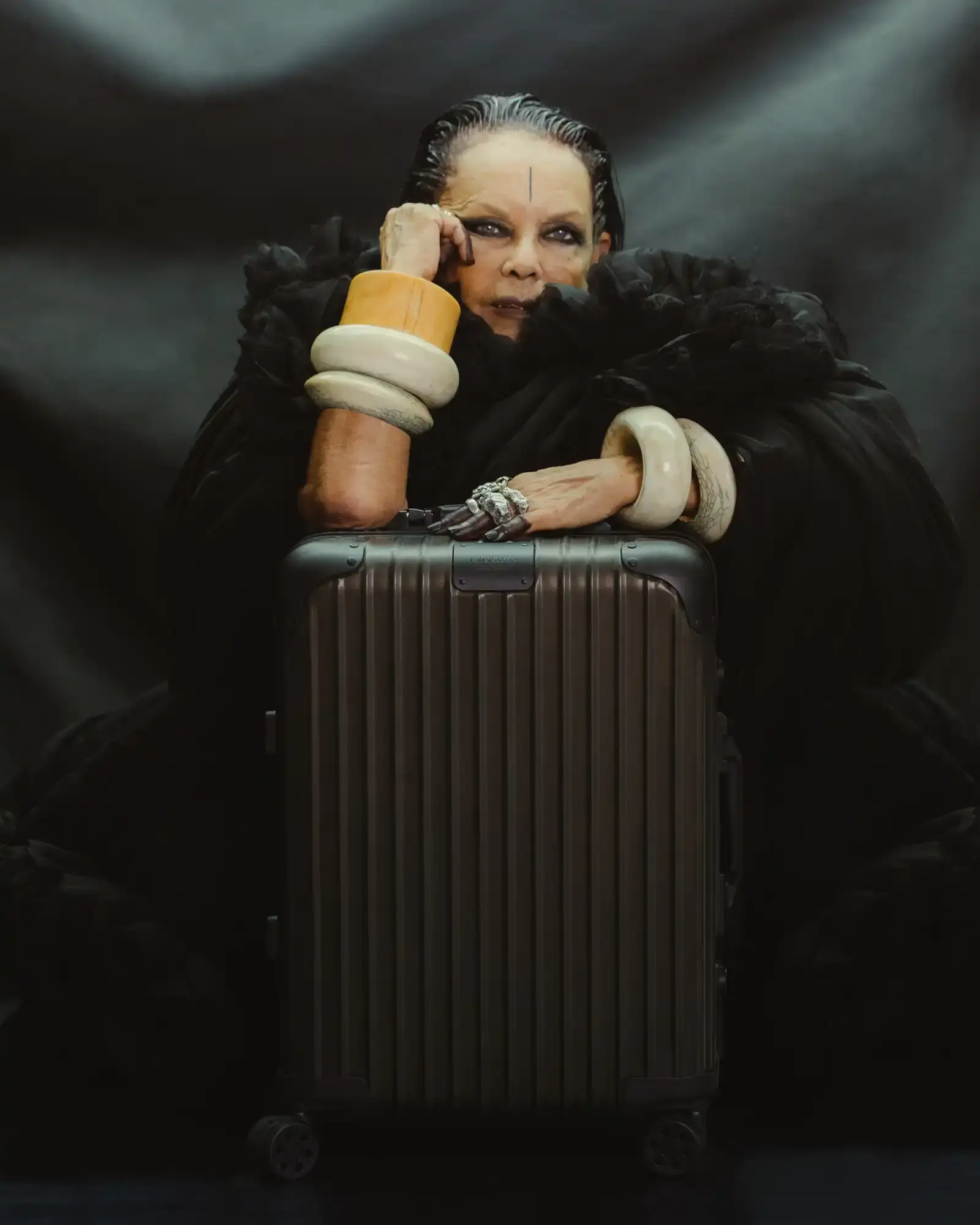 RIMOWA RIMOWA x Rick Owens bronze aluminum cabin suitcase with dark metallic finish and black leather details against neutral background (image 1 of 4)