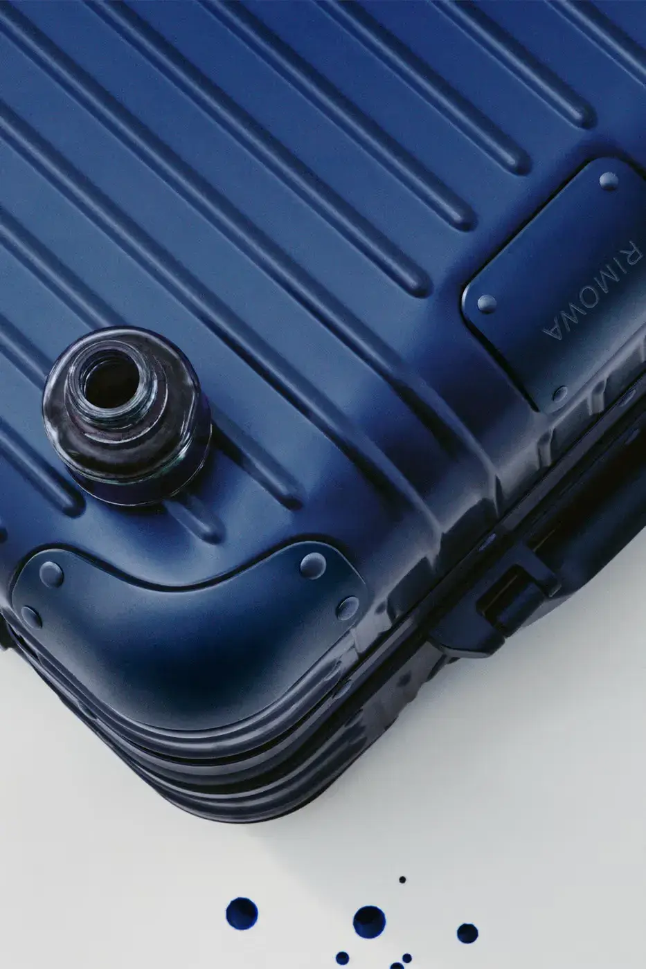 RIMOWA ORIGINAL LUGGAGE GAINS PERMANENT INK BLUE SHADE image announces the release of RIMOWA's permanent Ink Blue colorway for Original aluminium suitcases, detailing dimensions, pricing, and matching accessories. (image 6 of 9)