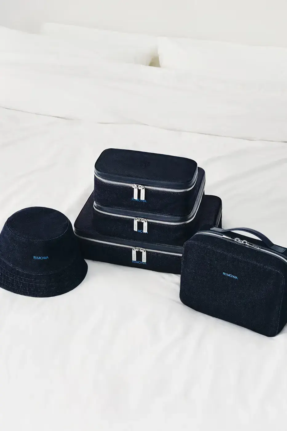 RIMOWA ORIGINAL LUGGAGE GAINS PERMANENT INK BLUE SHADE image announces the release of RIMOWA's permanent Ink Blue colorway for Original aluminium suitcases, detailing dimensions, pricing, and matching accessories. (image 9 of 9)
