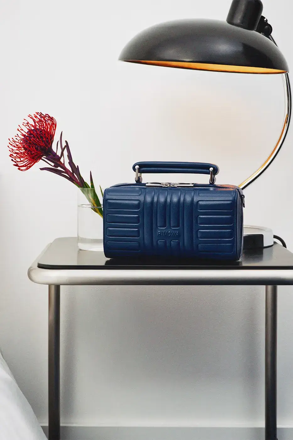 RIMOWA ORIGINAL LUGGAGE GAINS PERMANENT INK BLUE SHADE image announces the release of RIMOWA's permanent Ink Blue colorway for Original aluminium suitcases, detailing dimensions, pricing, and matching accessories. (image 3 of 9)