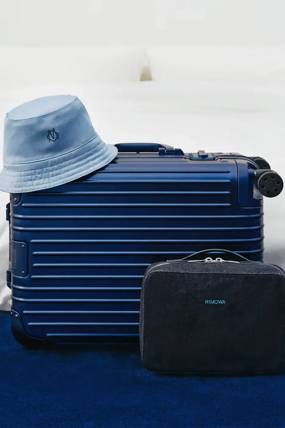 RIMOWA ORIGINAL LUGGAGE GAINS PERMANENT INK BLUE SHADE image announces the release of RIMOWA's permanent Ink Blue colorway for Original aluminium suitcases, detailing dimensions, pricing, and matching accessories. (image 8 of 9)