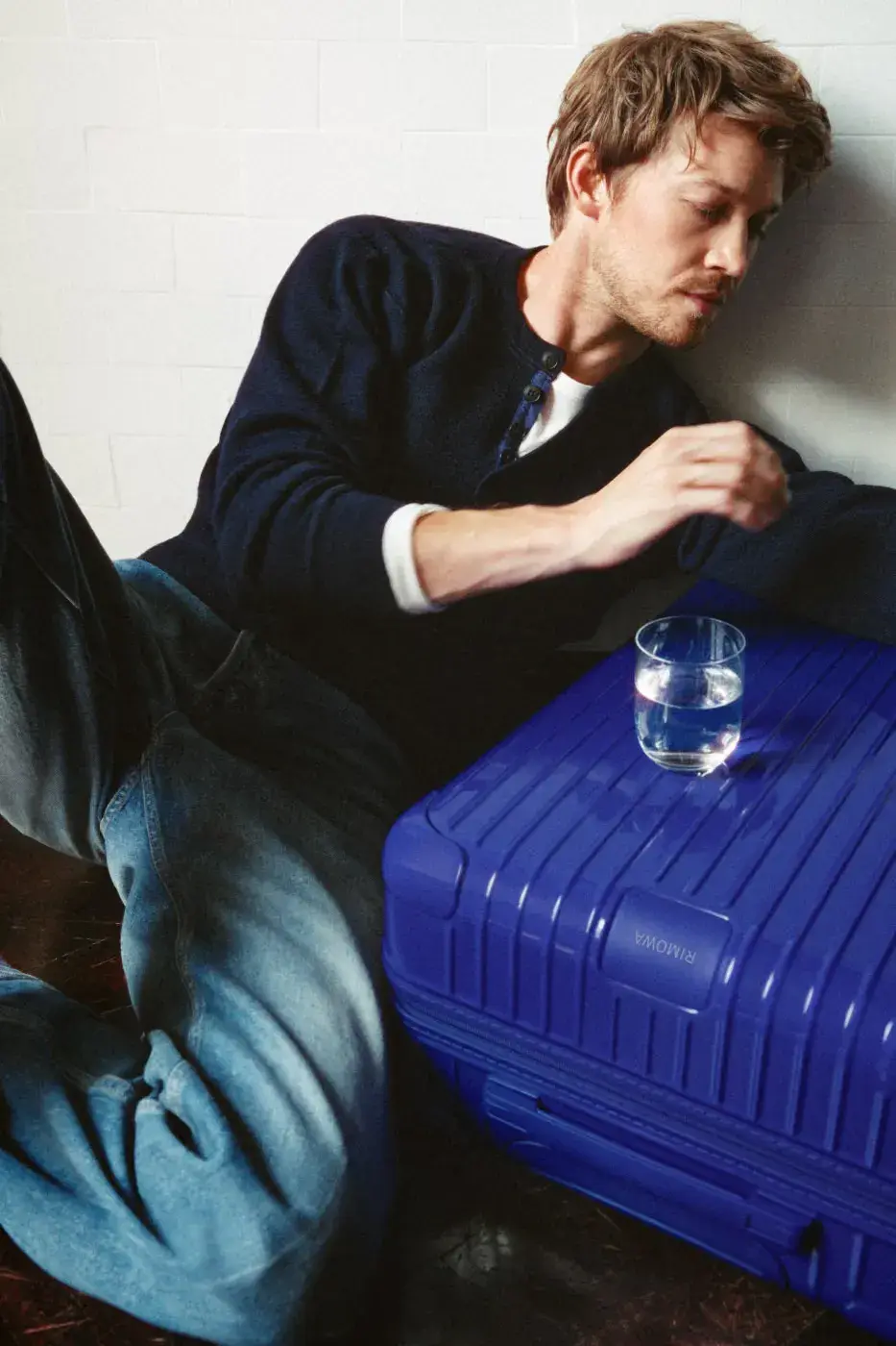 RIMOWA ADDS UMBER AND ULTRAMARINE TO ESSENTIAL AND GROOVE image about two new RIMOWA colors, Umber brown and Ultramarine blue, applied to Essential suitcases and Groove leather bags. Actor Joe Alwyn plays a young painter in the campaign. (image 2 of 10)