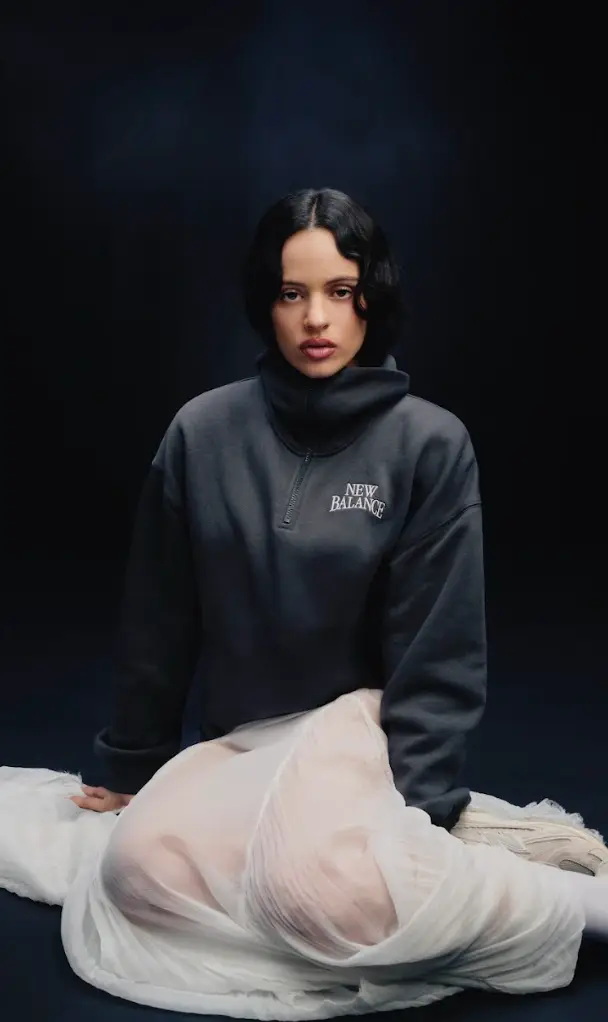 image about the New Balance 204L sneaker campaign featuring Rosalia. The text covers release details, pricing, shoe materials, and design specifications.