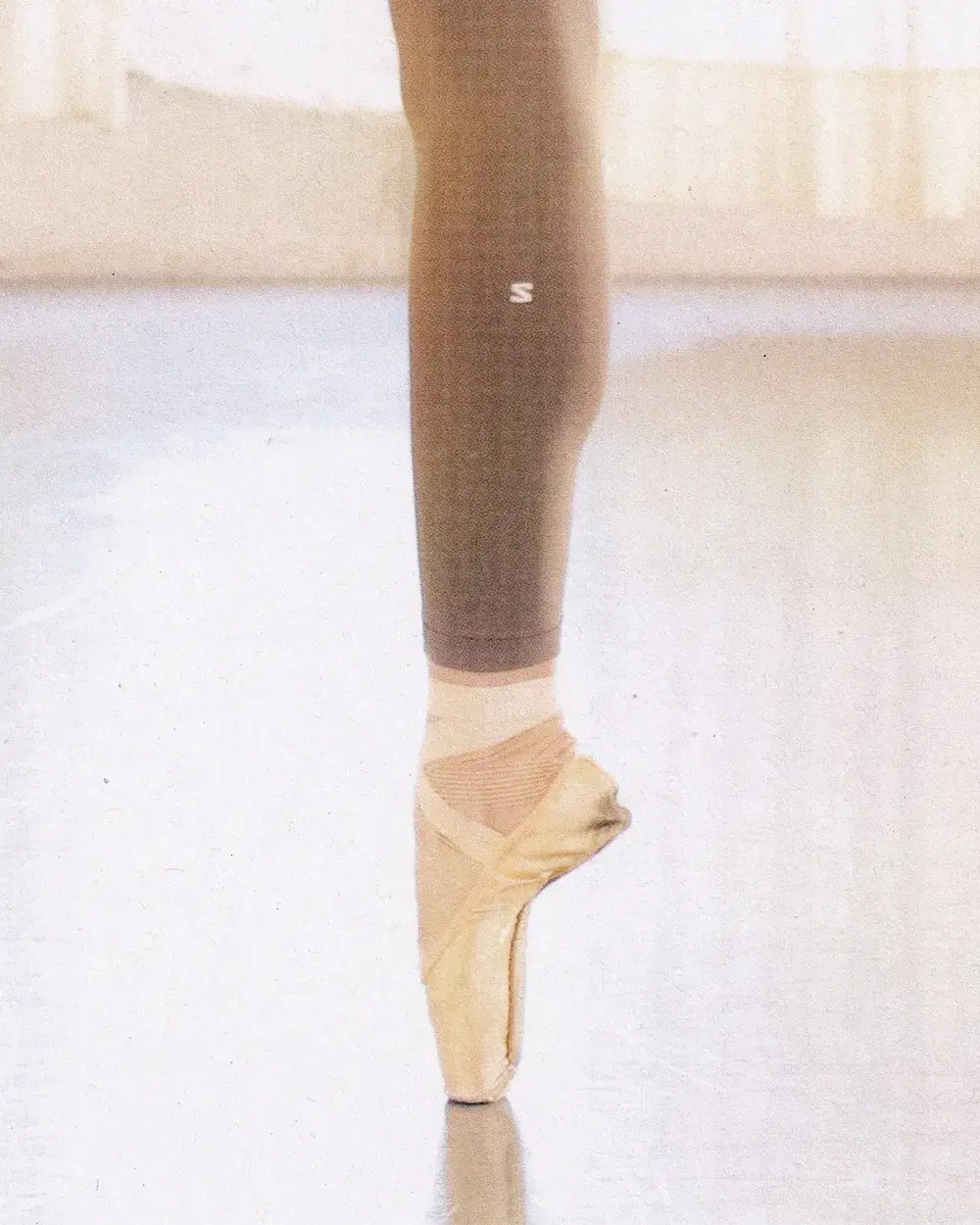 SALOMON PARTNERS WITH PARIS OPERA BALLET an image detailing the three-year partnership between French outdoor brand Salomon and the Paris Opera Ballet to supply athletic gear for dancers.