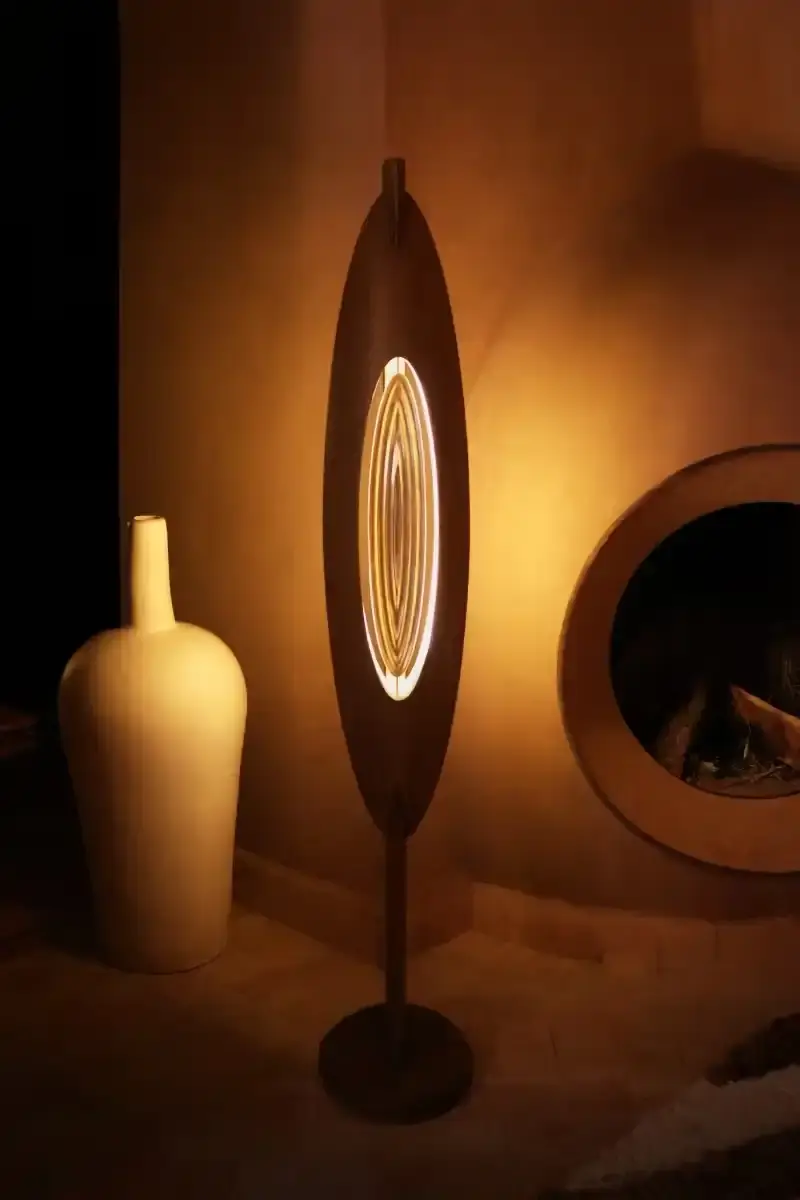 SALU IWADI GELEDE LAMP COLLECTION An image describing the Gelede lamp collection by Salu Iwadi Studio. The text details the materials and cultural meaning behind three lamp models. (image 7 of 11)