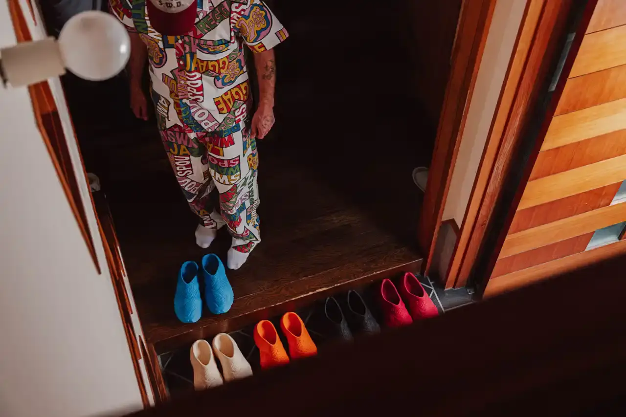 WOTHERSPOON PARTNERS WITH ZELLERFELD ON CUSTOM 3D SHOES image about fashion designer Sean Wotherspoon's collaboration with 3D printing company Zellerfeld to create a two-piece footwear collection called "Sean Double U." The piece discusses the custom manufacturing process, pricing, and design philosophy behind the sneaker and mule styles. Content includes quotes from Wotherspoon and details about the sustainable production methods used. (image 4 of 6)