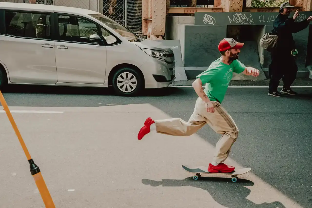 WOTHERSPOON PARTNERS WITH ZELLERFELD ON CUSTOM 3D SHOES image about fashion designer Sean Wotherspoon's collaboration with 3D printing company Zellerfeld to create a two-piece footwear collection called "Sean Double U." The piece discusses the custom manufacturing process, pricing, and design philosophy behind the sneaker and mule styles. Content includes quotes from Wotherspoon and details about the sustainable production methods used. (image 3 of 6)