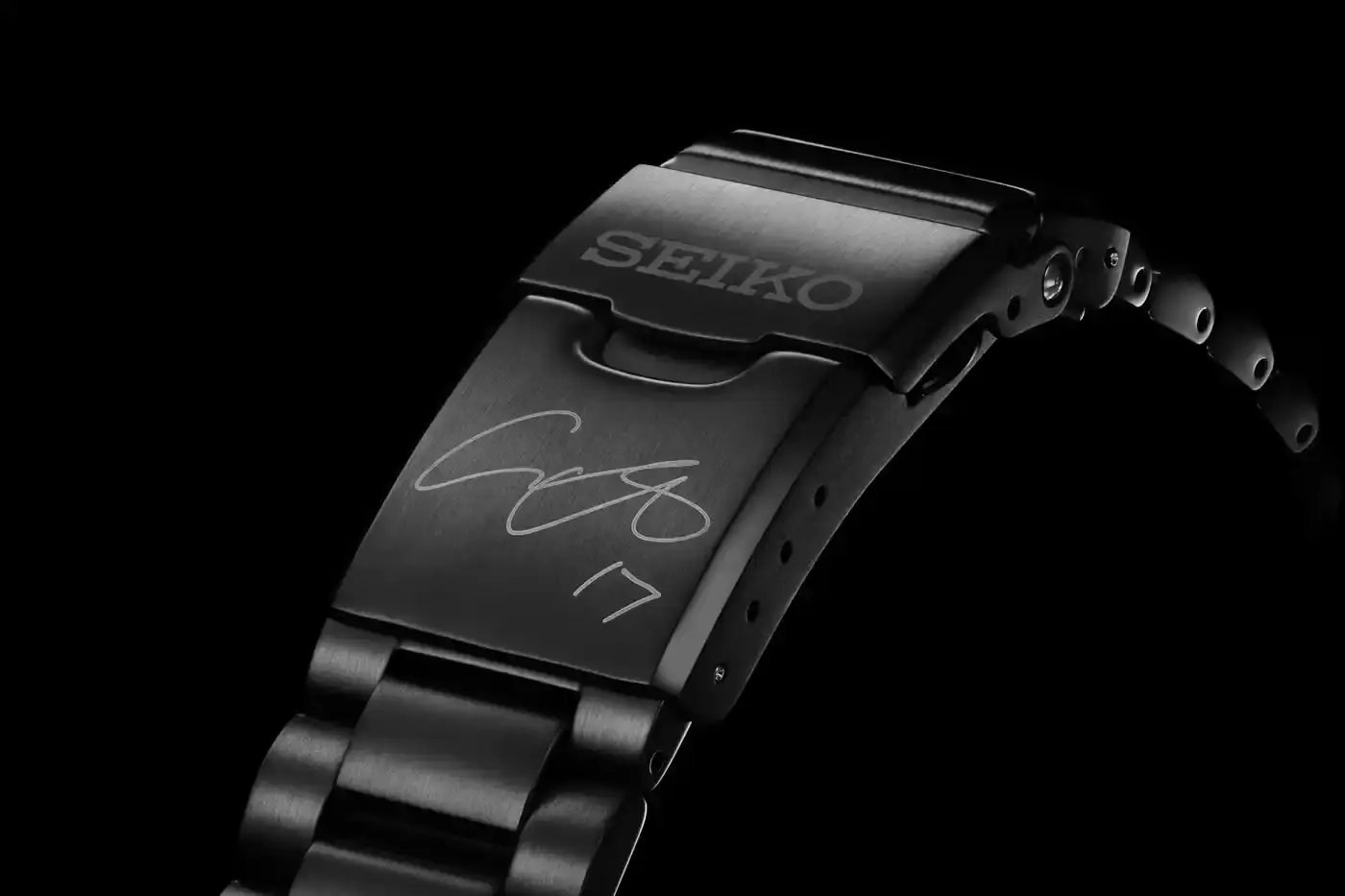 Seiko Two Seiko Prospex limited edition watches honoring Shohei Ohtani. Left watch shows model SBEJ023 with black dial and blue bezel. Right watch displays model SBEJ025 with white dial. Both feature Dodgers team colors and Ohtani's signature on the clasp. (image 5 of 6)